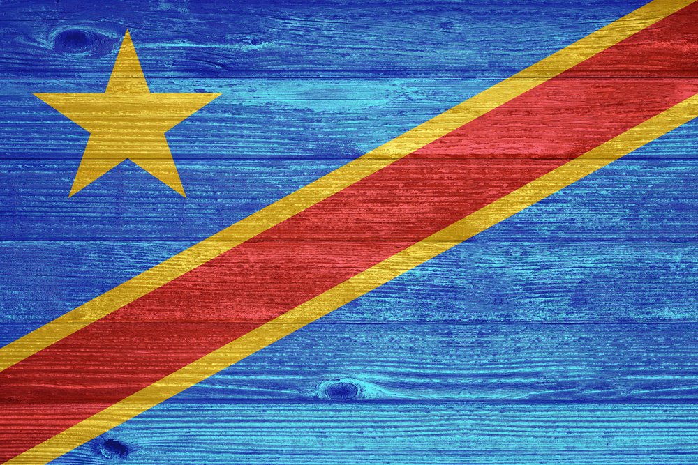 Democratic Republic of the Congo Flag painted on old wood plank background 